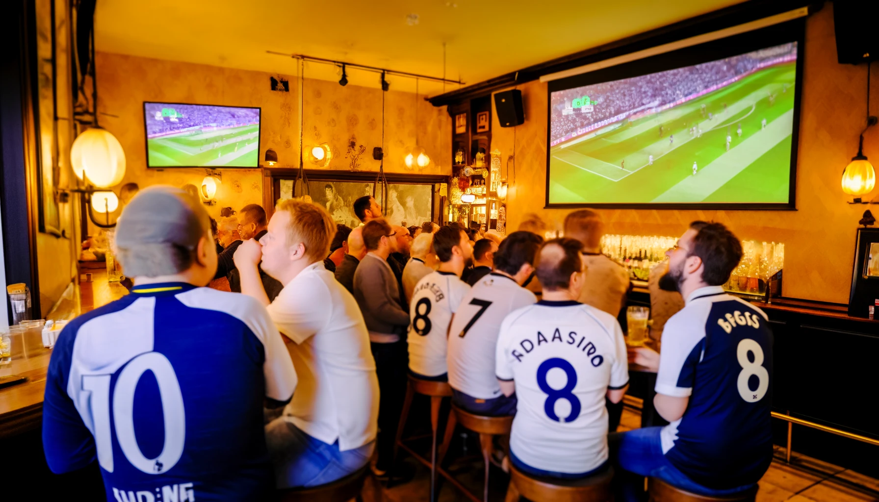 DALL·E 2024-04-06 18.49.33 – A cozy and lively Swedish pub scene with Tottenham Hotspur fans watching a match. The fans are dressed in Spurs jerseys, some cheering with their hand